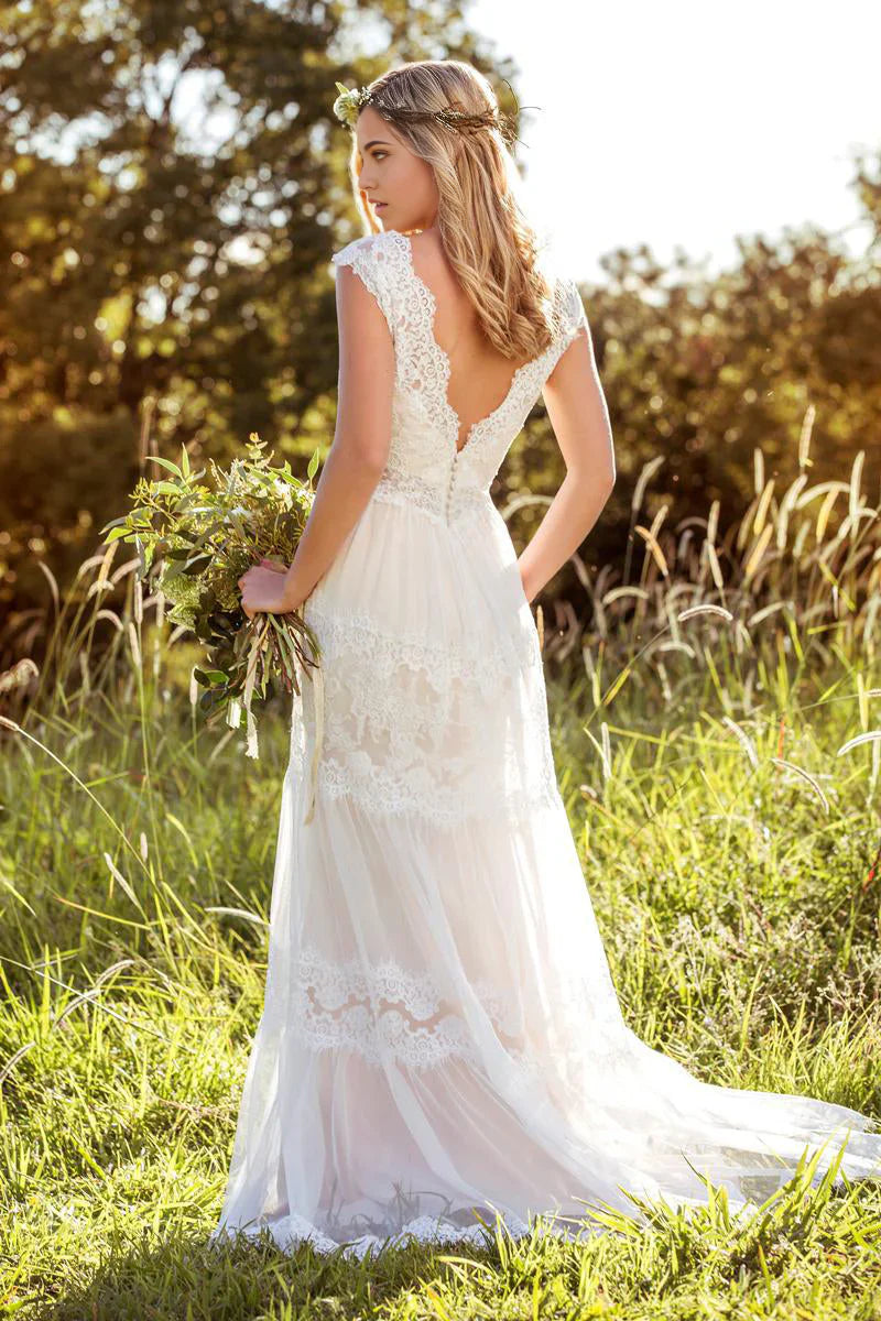 Back view of the A-line wedding gown showing flowing tulle.