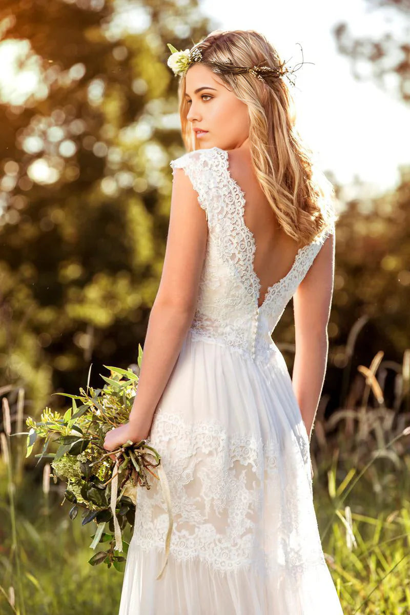 Side view of the bridal gown, highlighting the cap sleeves and A-line silhouette.