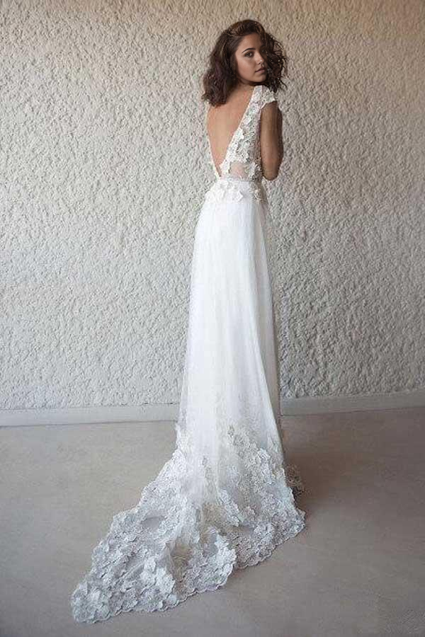 Back view of the ivory A-line bridal gown, featuring a flowing skirt.