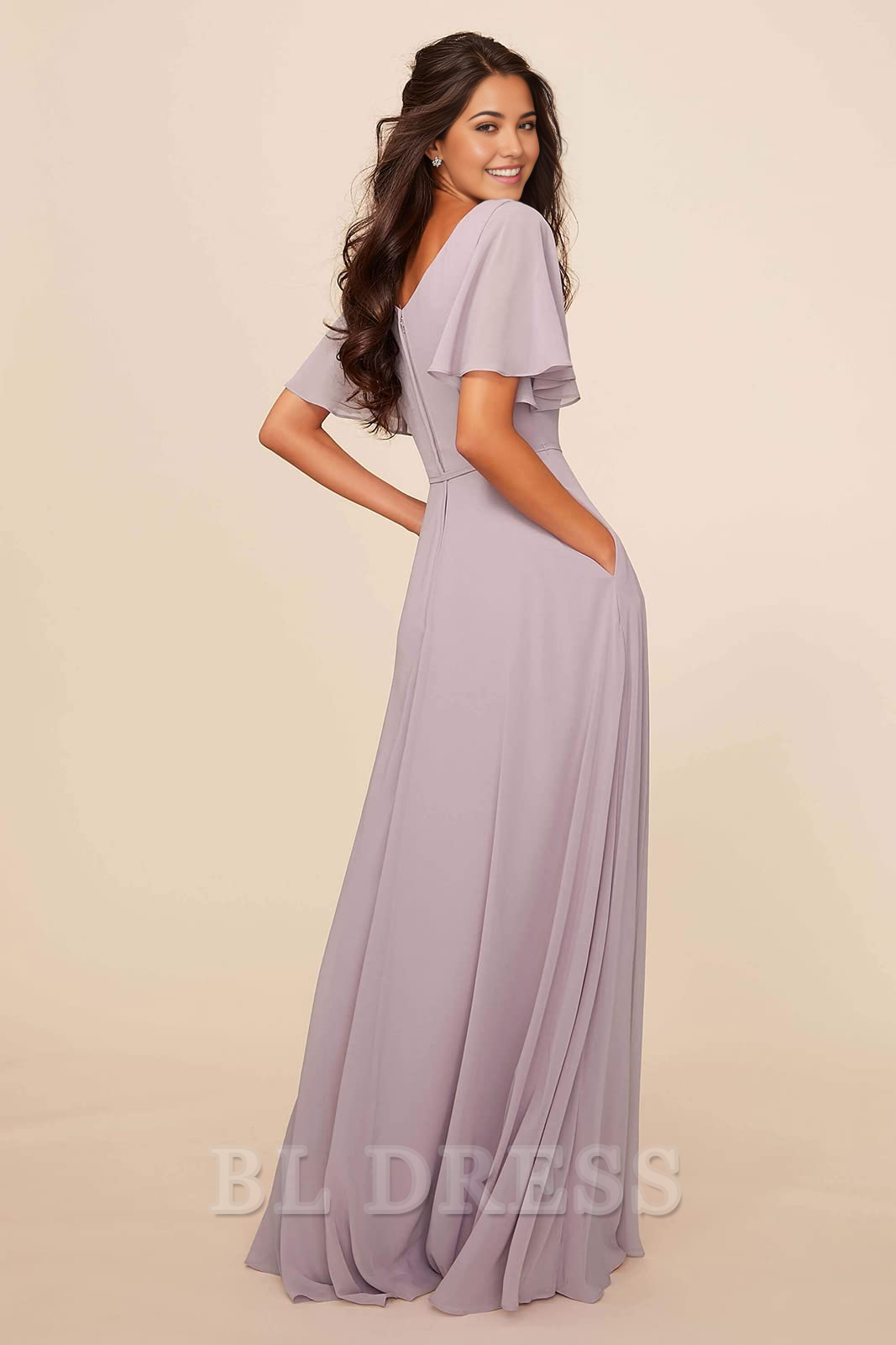 Side view of a woman in an A-line V-neck chiffon bridesmaid dress, showing the silhouette.
