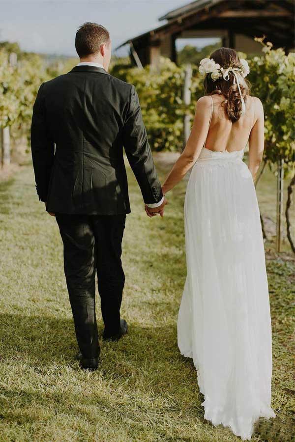 Side view of the flowing A-line chiffon wedding dress, showcasing its graceful silhouette.