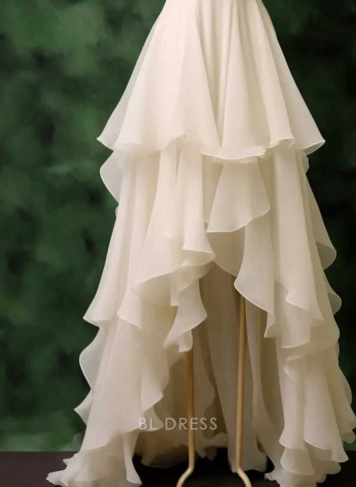 Back view of a white A-line formal gown, suitable for prom or bridesmaids.