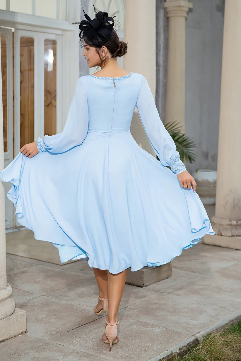 Side view of a woman wearing a flowing A-line chiffon V-neck gown.