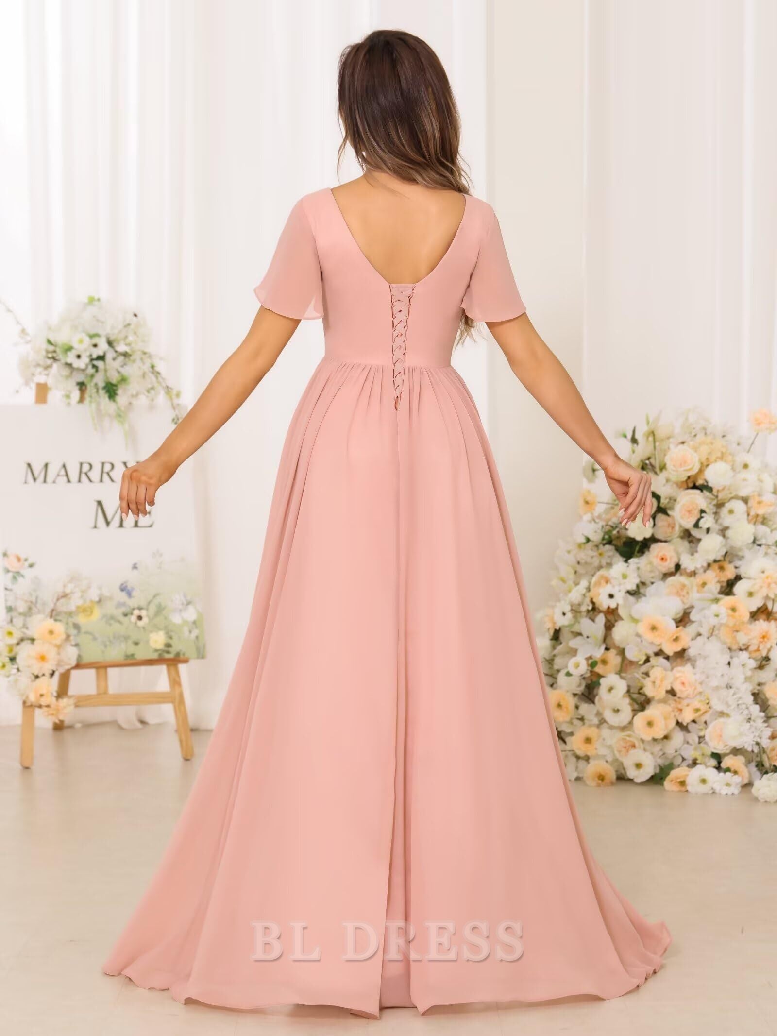 Model showcasing the flowing A-line chiffon dress with a V-neck.