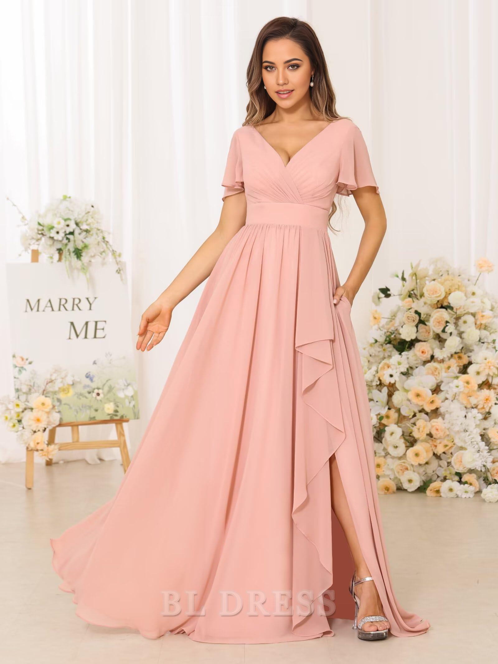 Full length view of a pleated V-neck formal dress in chiffon.