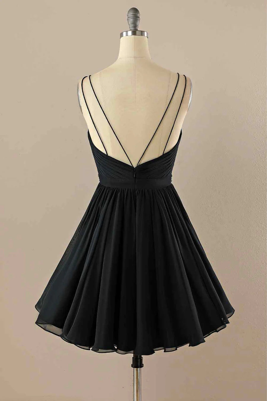 Close-up of the intricate pleats and sparkling beading on the chiffon homecoming dress.