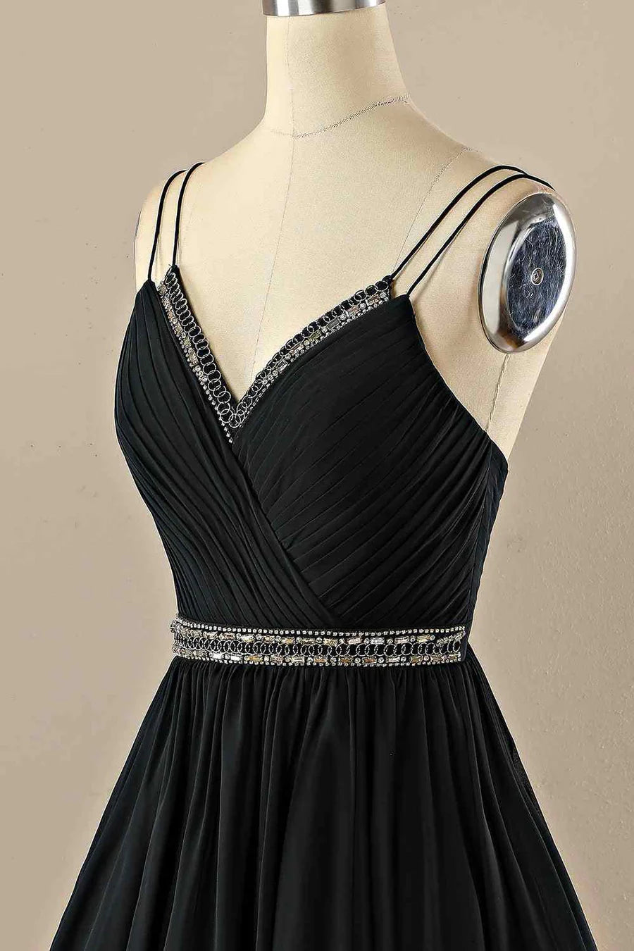 Detail of the delicate double straps and V-neckline on the homecoming dress.