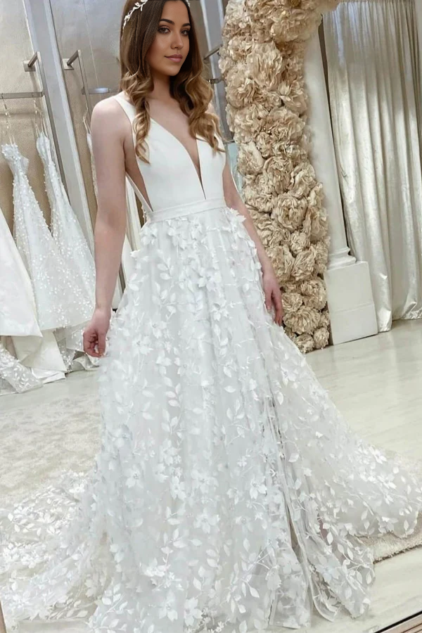 Elegant A-line V-neck wedding dress with floral lace detailing.