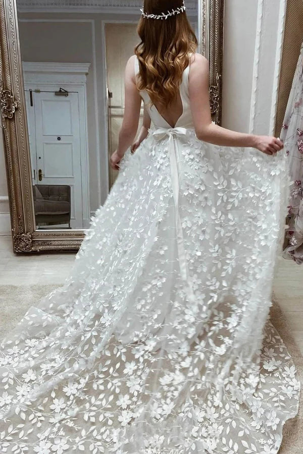 Close-up of floral lace on the A-line V-neck wedding gown.