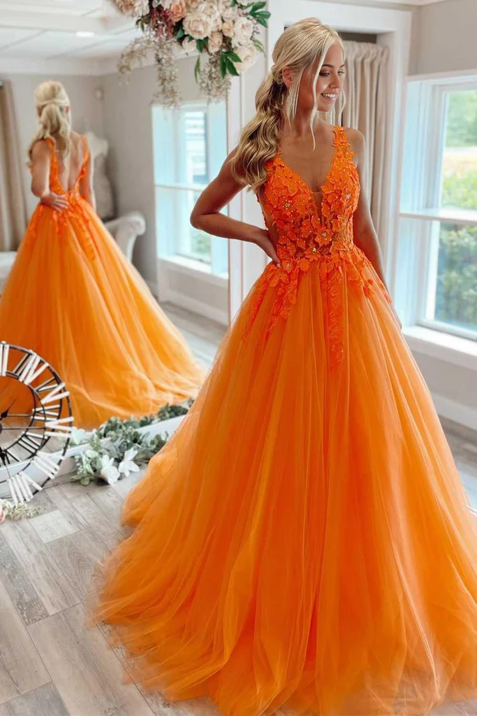 Model wearing an elegant orange floral tulle A-line V-neck long prom dress.