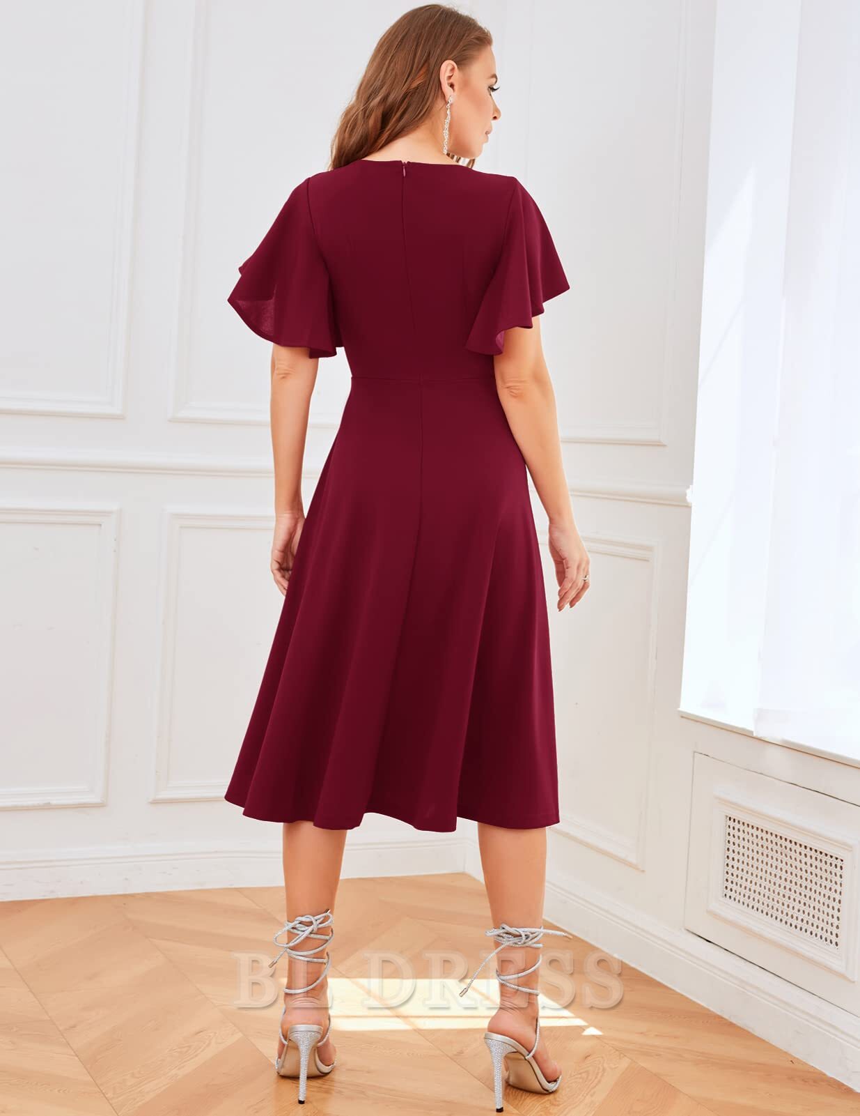 Back view of the A-line V-neck tea length dress.