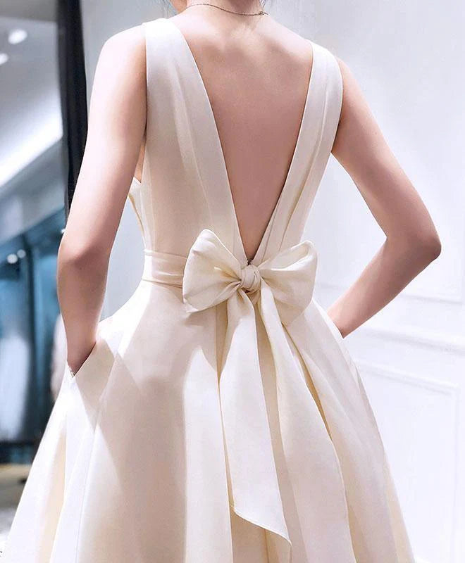 Model wearing A-line V-neck high-low dress.
