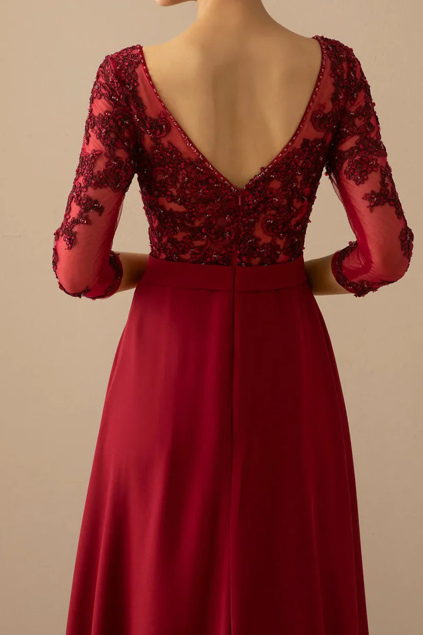 Full length A-line dress with illusion sleeves.