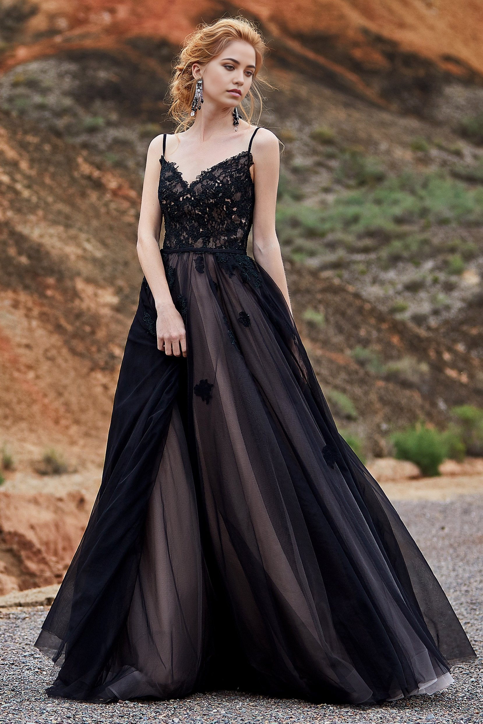 Black A-line wedding dress with lace applique and spaghetti straps.
