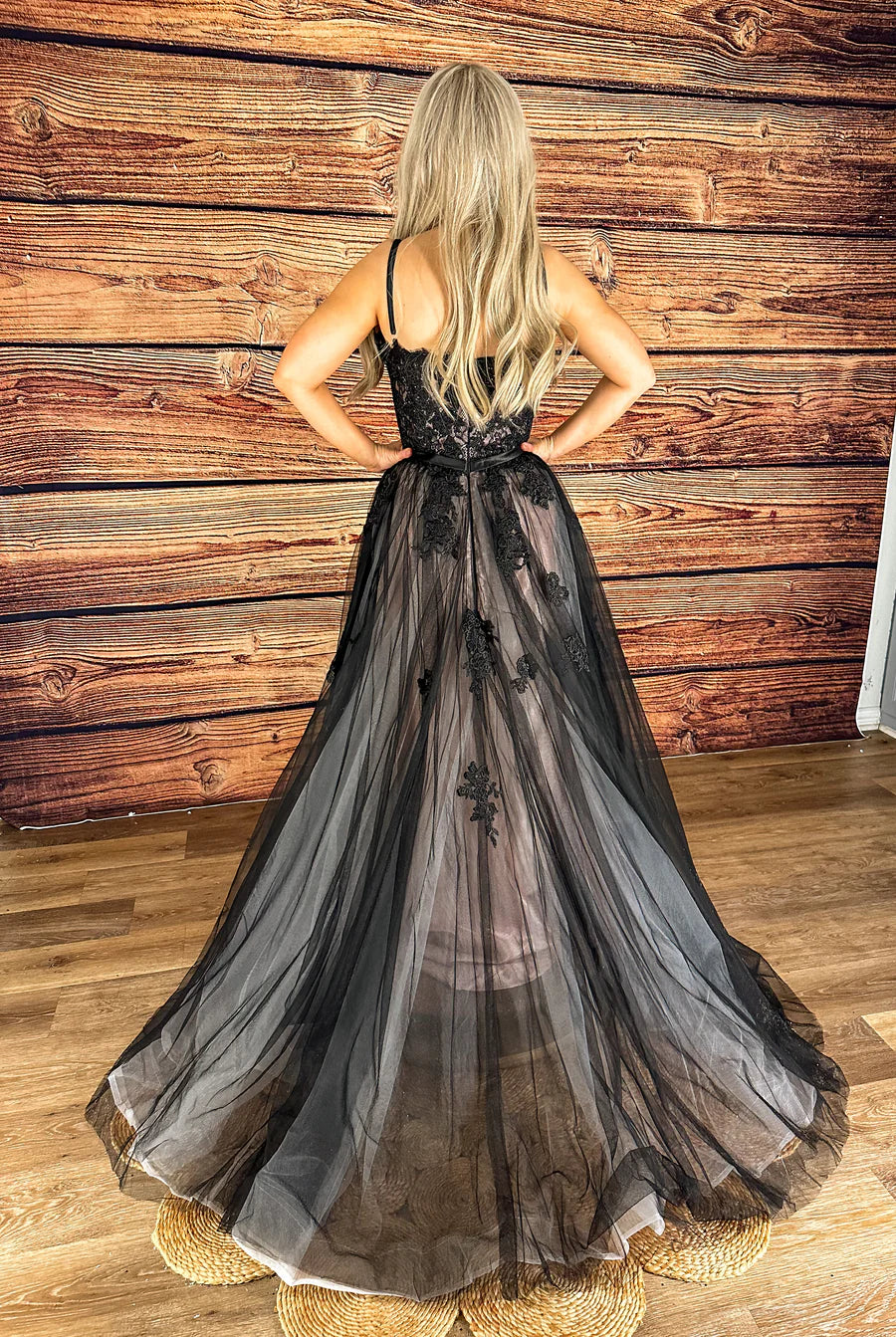 Side view of the black A-line wedding dress, showcasing the flowing skirt.