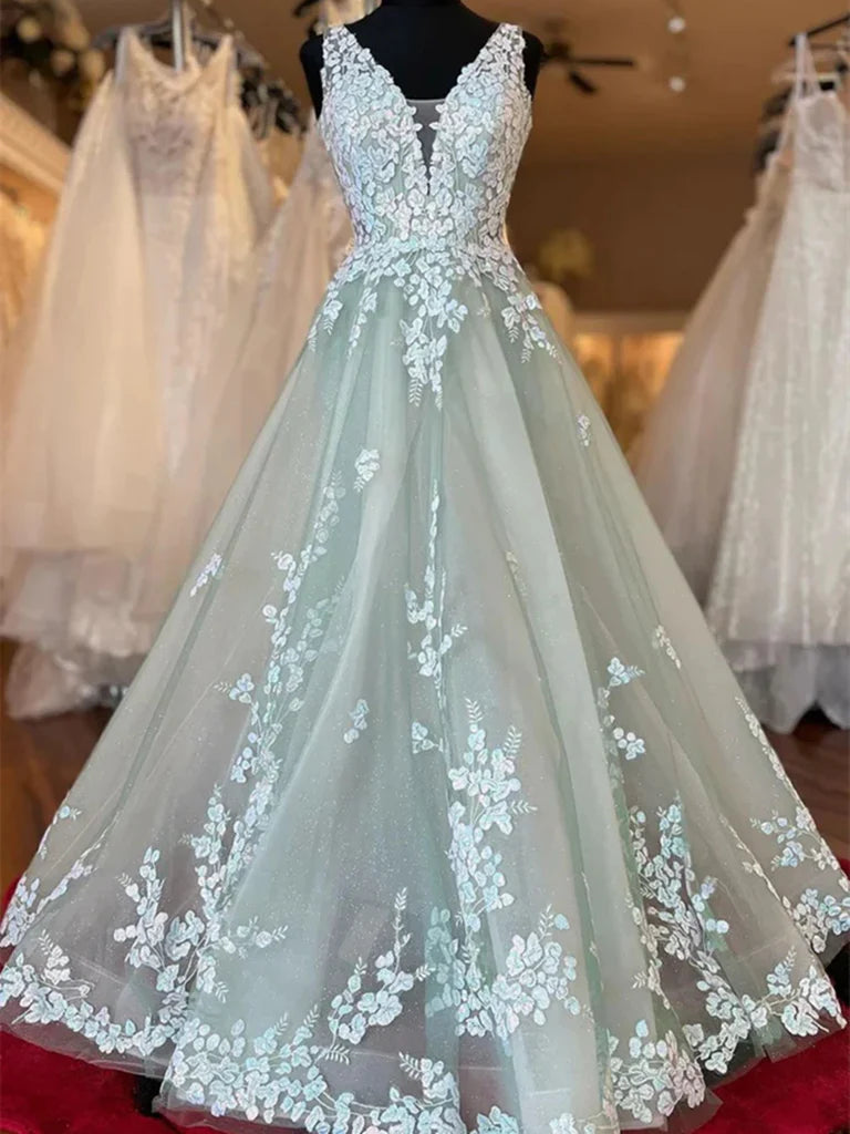 Woman posing in an elegant A-line V-neck lace applique long prom dress.