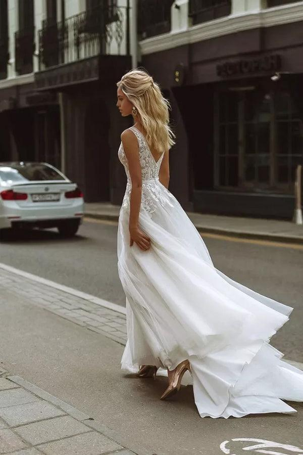 Back view of a lace bridal gown, showcasing delicate details.