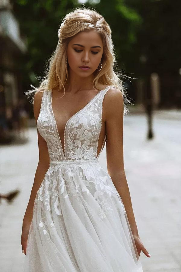 Side profile of a bride wearing an A-line V-neck wedding dress.