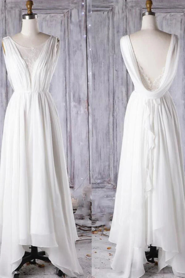Side profile of the flowing A-line chiffon wedding dress.