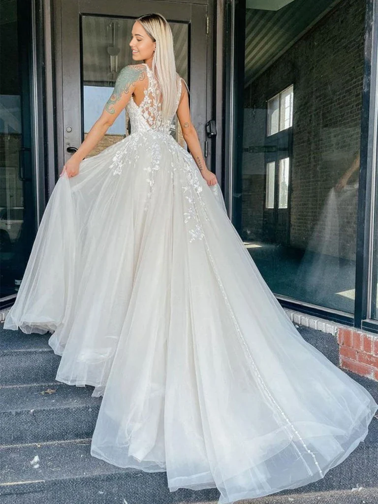 Full view of the ivory lace floral formal evening gown.