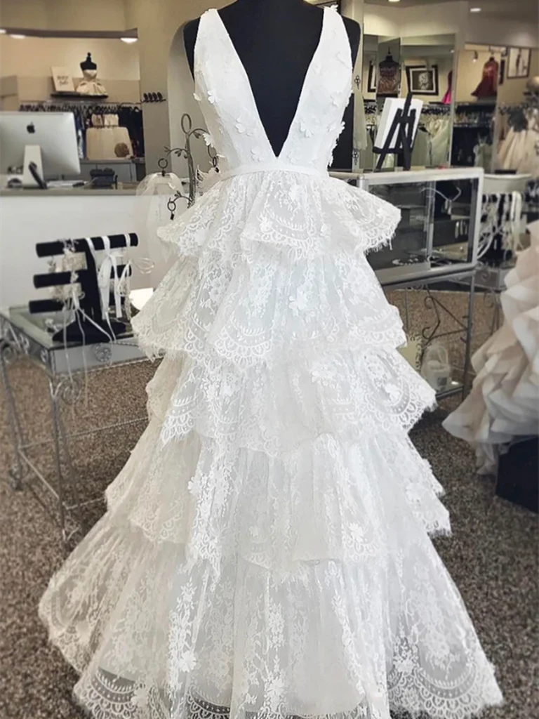 Woman wearing an elegant A-line V-neck lace long formal dress.