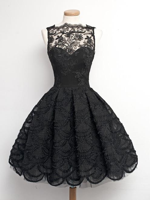 Woman wearing an elegant A-line V-neck lace prom or homecoming dress.