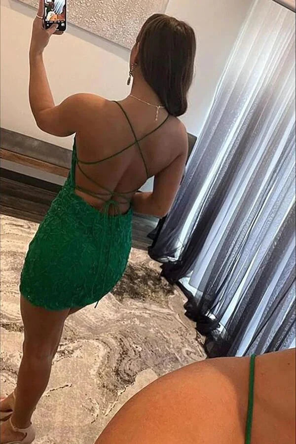 Side view of green lace short prom dress with delicate spaghetti straps.