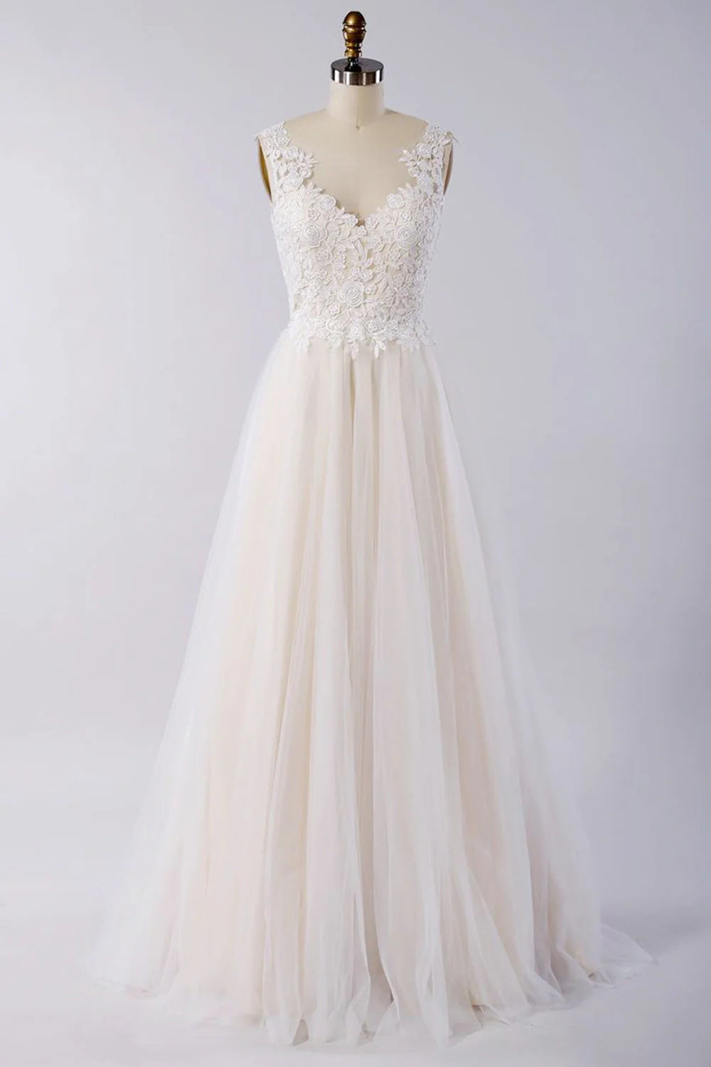 Elegant A-line wedding dress with lace appliques and an open back.