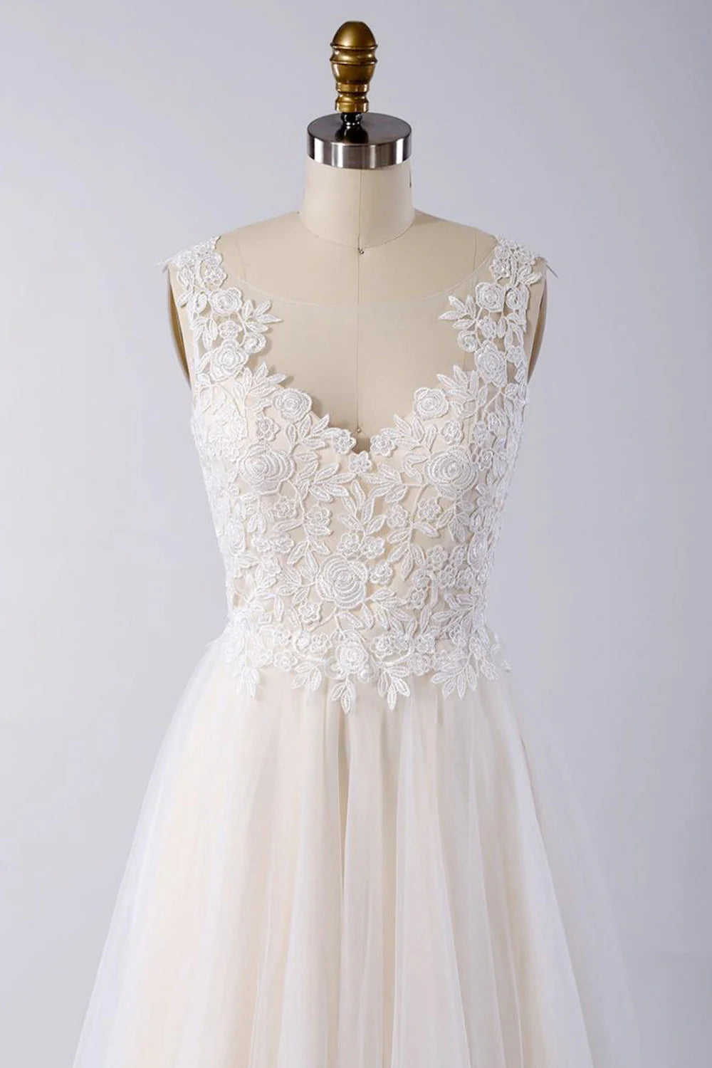Back view of the A-line wedding dress, showcasing the open back and flowing tulle skirt.