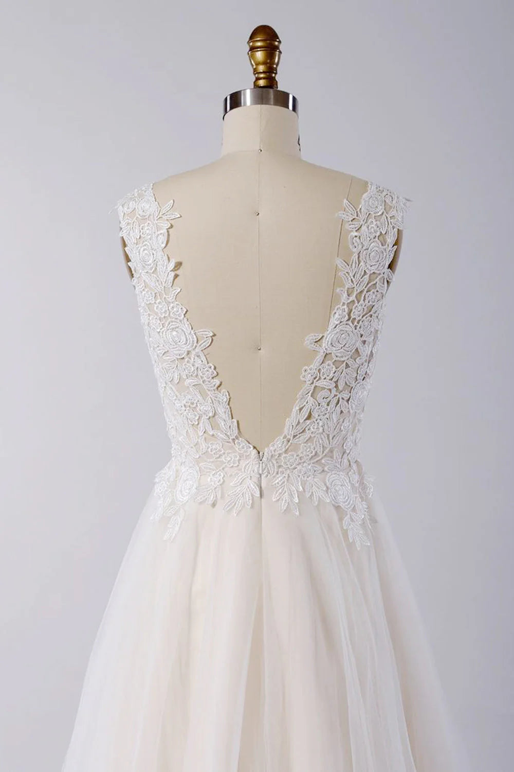 Side view of the A-line wedding dress, highlighting its silhouette and train.