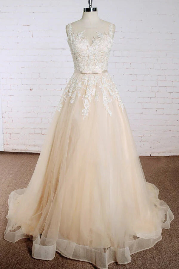 Elegant A-line V-neck wedding dress with delicate lace appliques and flowing tulle.
