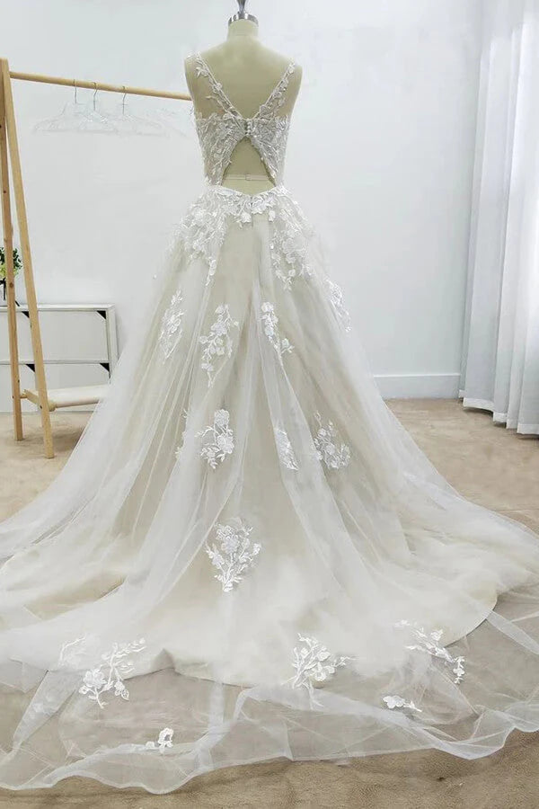 Side view of elegant A-line wedding gown with delicate appliques.
