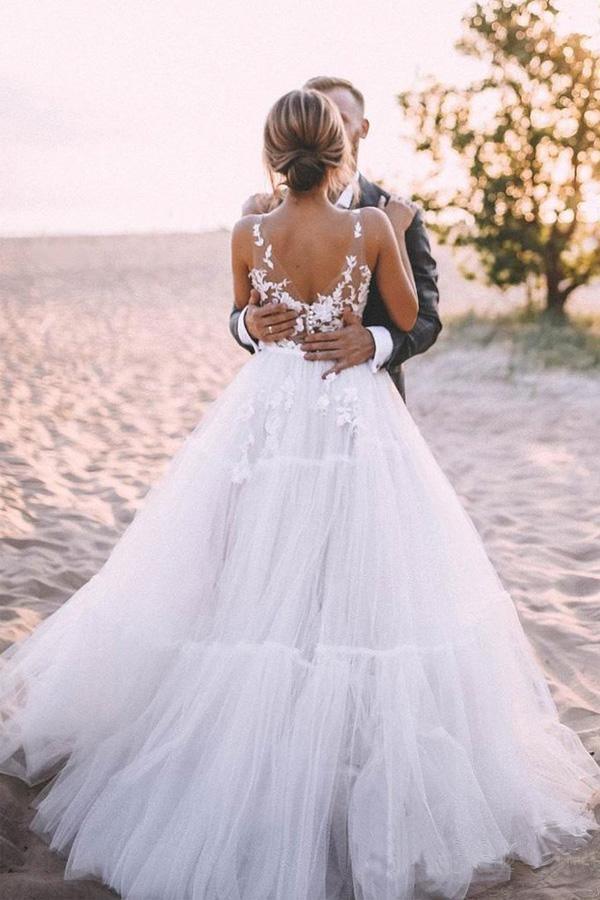 Back view of A-line bridal gown showing layered tulle and train.