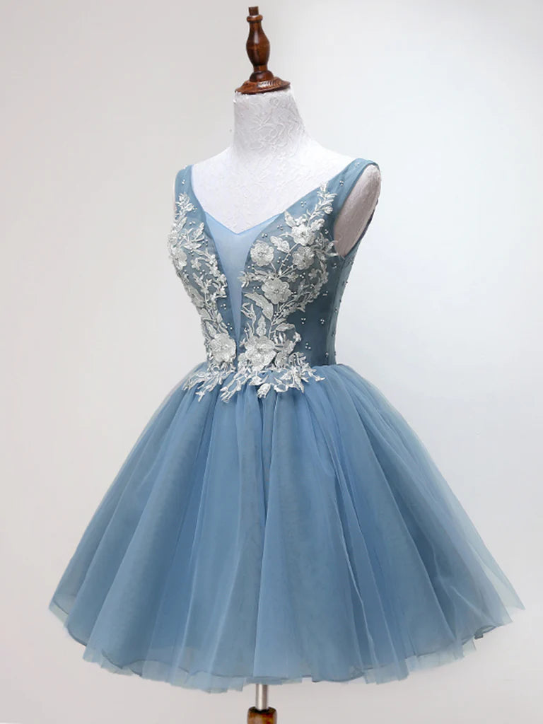 Back view of an A-line short lace tulle V-neck dress on a model.