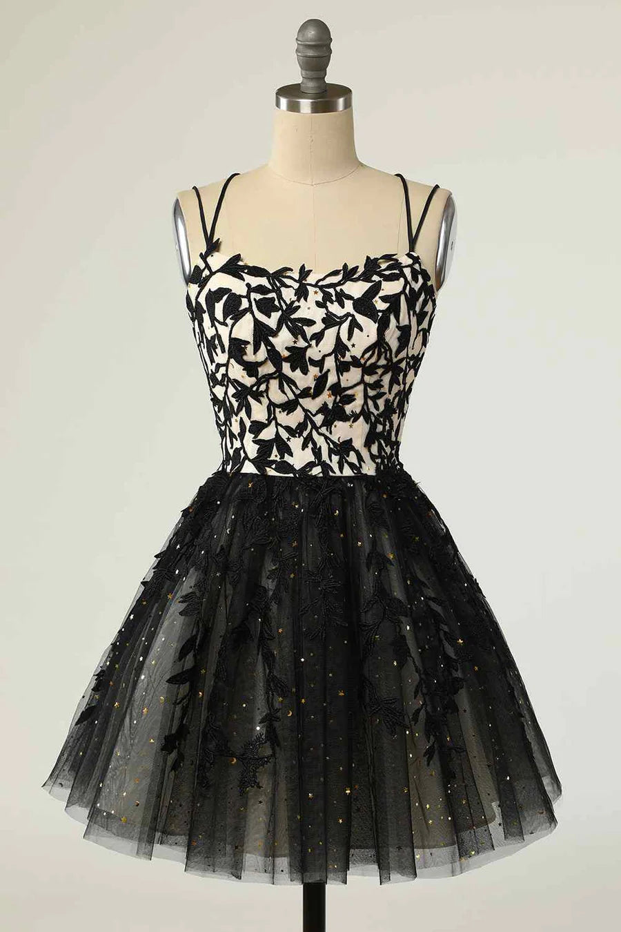 Front view of the A-line mini homecoming dress with V-neck, double spaghetti straps, lace-up back, and applique details.