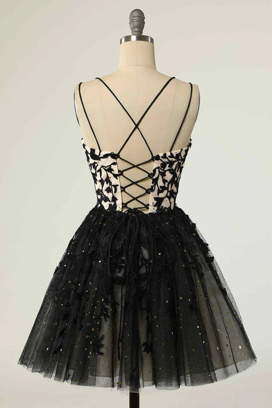 Side view of the A-line mini homecoming dress, showcasing the flowy skirt and double spaghetti straps.