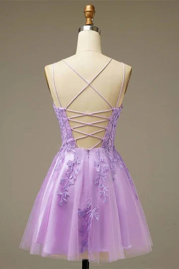 Close-up of the delicate applique and tulle fabric on the A-line mini dress.