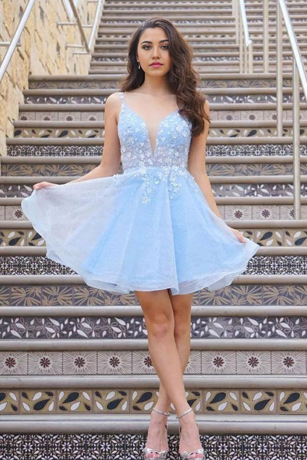Back view of a light blue lace floral short dress.