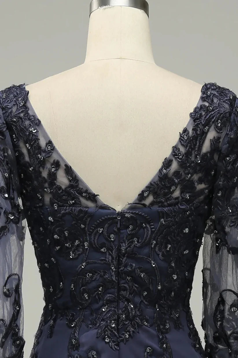 Close-up of the intricate appliques on the elegant mother of the bride dress.