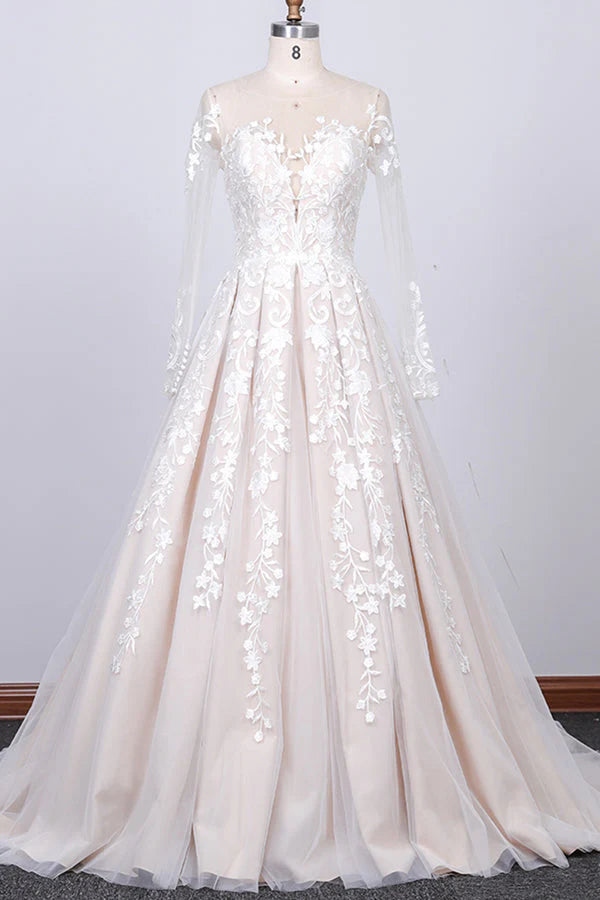 Elegant A-line long sleeve wedding dress with lace appliques.