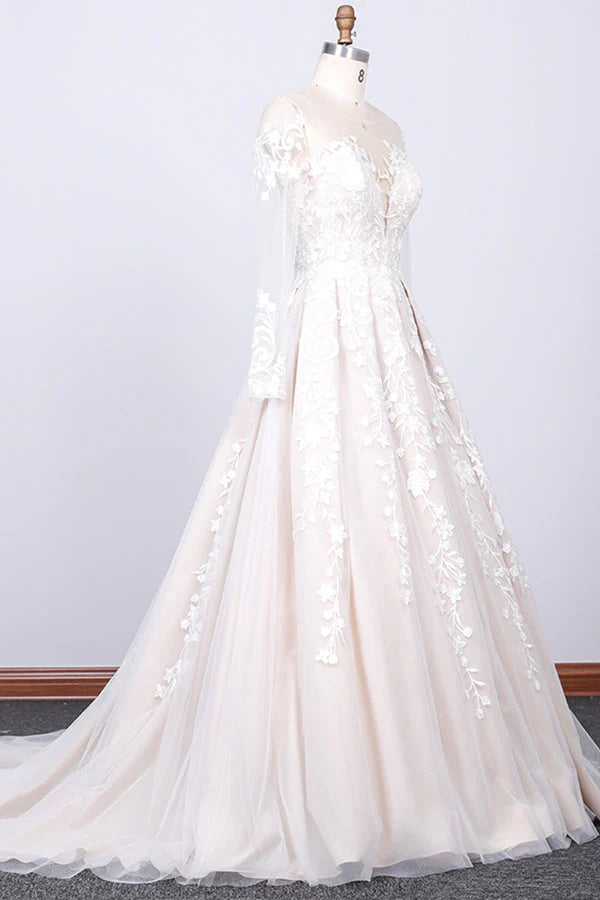 Bride wearing a beautiful A-line lace and tulle wedding gown.