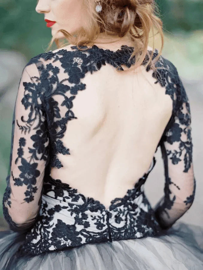 Full view of a sophisticated long sleeve black lace wedding dress.