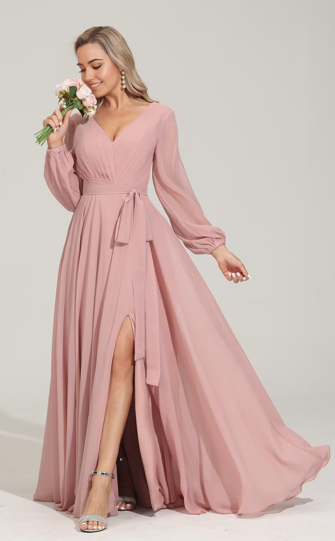Woman wearing an elegant A-line V-neck long sleeve chiffon formal dress.
