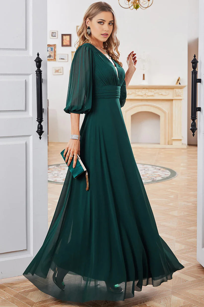 Close-up of the V-neckline and long sleeves of the elegant dress.