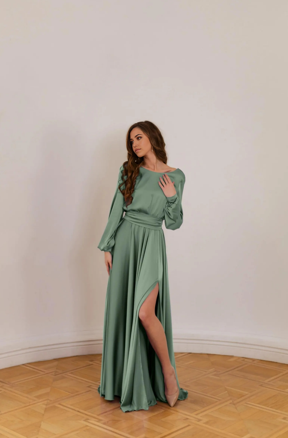 Woman wearing an elegant A-line V-neck long sleeve formal dress.