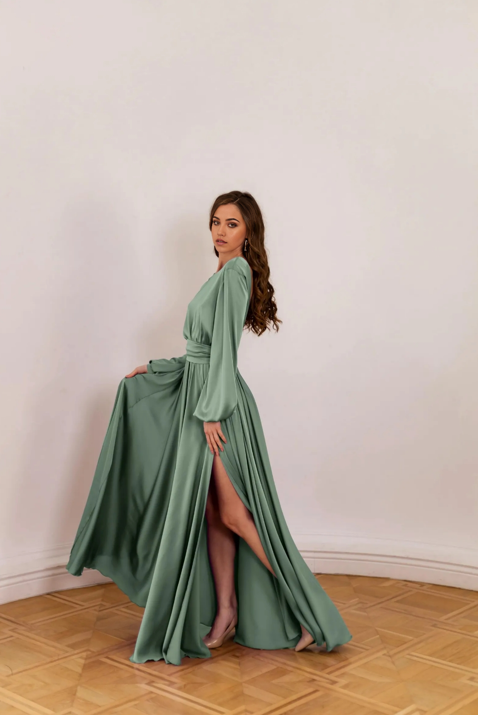 Woman posing in a graceful A-line V-neck long sleeve bridesmaid dress.