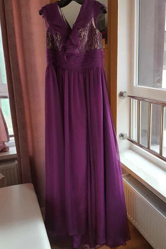 Back view of a woman in a flowy floor-length ruffled chiffon formal gown.