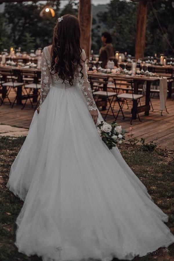 Side view of an A-line wedding dress, highlighting long sleeves and lace details.