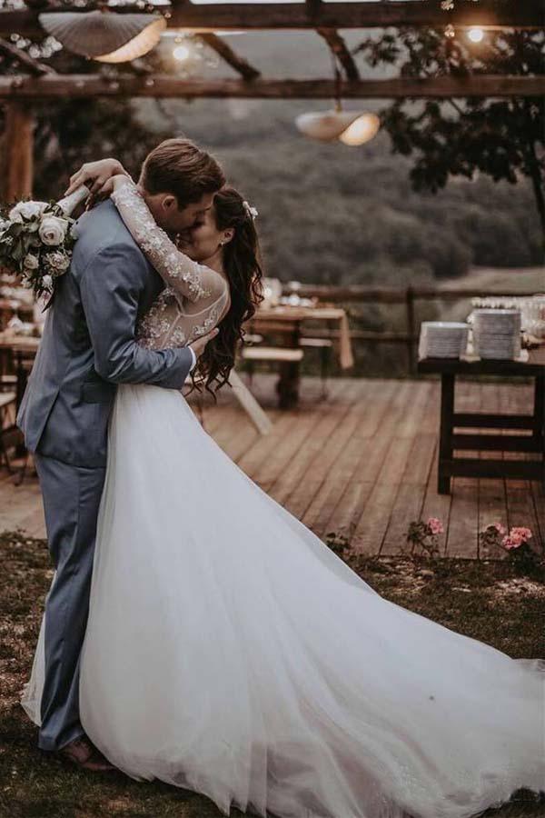 Back view of the A-line tulle wedding dress, showing the elegant train and lace details.