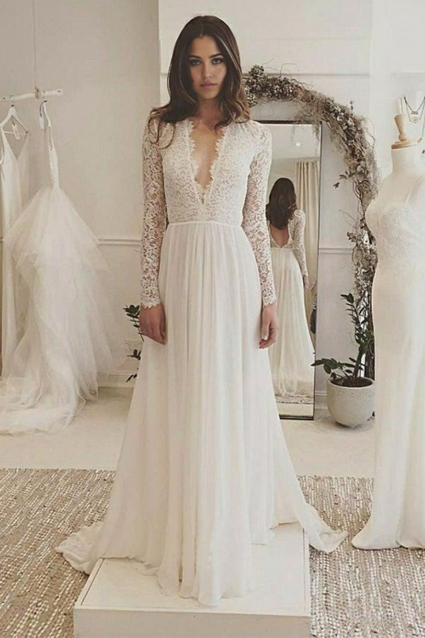 Ivory A-line chiffon wedding dress with long sleeves and lace details.